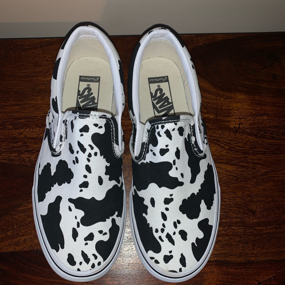 Vans cow print slip ons